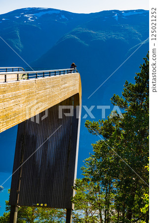 Tourist take photo on Stegastein viewpoint Norway 125021252