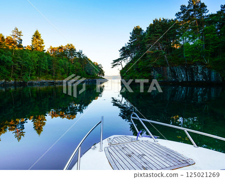 Motor boat on water 125021269