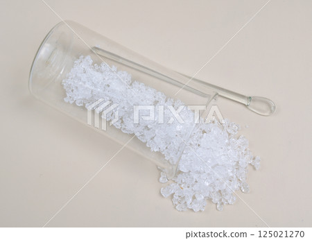 Cadmium nitrate powder on beige background Cadmium nitrate powder on beige background 125021270
