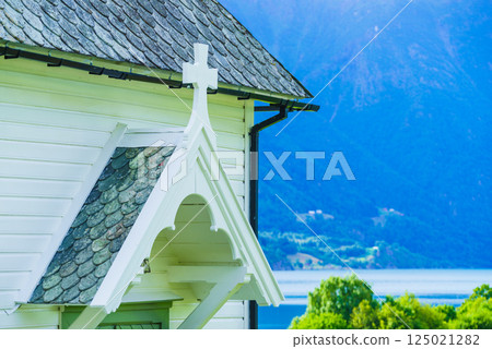 Wooden church in Nes village at fjord, Norway Wooden church in Nes village at fjord, Norway 125021282