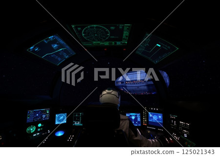 Pilot in spaceship control room 125021343