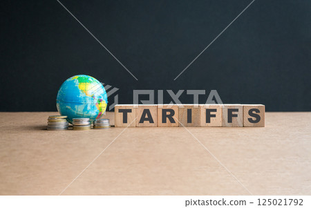 Globe with coins and message, Tariffs on wooden blocks. 125021792
