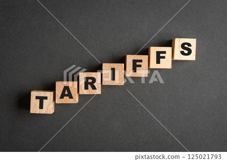 Tariffs, word on square wooden blocks. Tariffs, word on square wooden blocks. 125021793