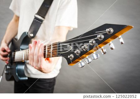 Close up on guitar fretboard 125022052