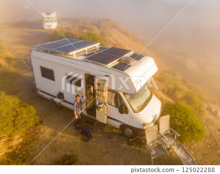Caravan solar panels on roof camping on nature. Aerial view Caravan solar panels on roof camping on nature. Aerial view 125022288