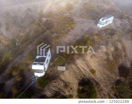 Caravan solar panels on roof camping on nature. Aerial view Caravan solar panels on roof camping on nature. Aerial view 125022289