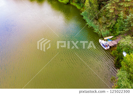Aerial view yacht on lake in Tuchola Forests, Poland. Aerial view yacht on lake in Tuchola Forests, Poland. 125022300