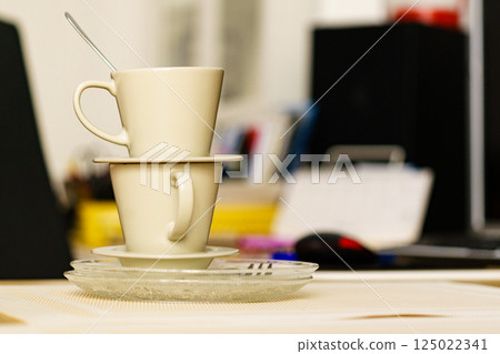 Dirty cups after coffee drinking, messy desk Dirty cups after coffee drinking, messy desk 125022341