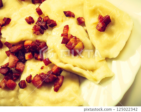 Dumplings with meat bacon scratchings. 125022342