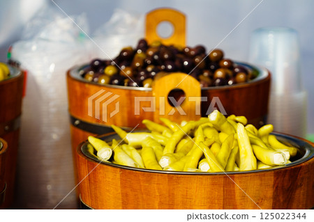 Olives and peppers for sale at market Olives and peppers for sale at market 125022344