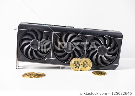 High-performance graphics card with three cooling fans and golden Bitcoin coins symbolizing cryptocurrency mining on white background High-performance graphics card with three cooling fans and golden Bitcoin coins symbolizing cryptocurrency mining on white background 125022640