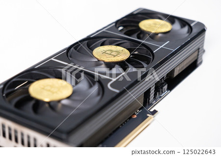 High-end black graphics card with three fans and golden Bitcoin coins on top, representing GPU mining and cryptocurrency technology concept High-end black graphics card with three fans and golden Bitcoin coins on top, representing GPU mining and cryptocurrency technology concept 125022643