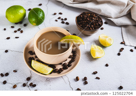 A cup of latte infused with lime on the table A cup of latte infused with lime on the table 125022704