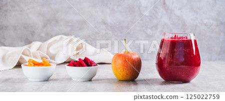 ABC juice from beetroot, carrot and apple for detox in a glass on the table web banner ABC juice from beetroot, carrot and apple for detox in a glass on the table web banner 125022759