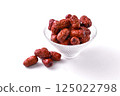 Glass plate with red jujube on white background, medium wood 125022798