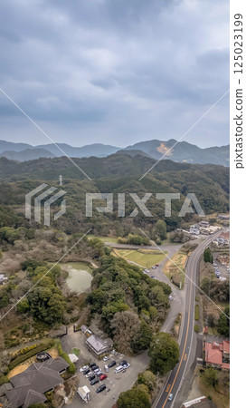 March 26 2025 Scenic Rural Landscape with Dense Forest and Winding Roads 125023199