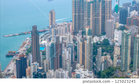 April 4 2025 Urban Hong Kong Buildings and Surrounding Green Hills, hk April 4 2025 Urban Hong Kong Buildings and Surrounding Green Hills, hk 125023245
