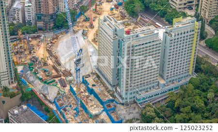 April 4 2025 View of an Urban High-Rise Construction Site and Nearby Buildings, hk April 4 2025 View of an Urban High-Rise Construction Site and Nearby Buildings, hk 125023252