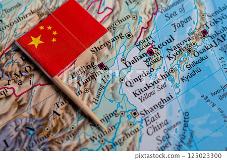 A close-up of the flag of China on the map. The capital Beijing. Close-up of the world map. China 125023300