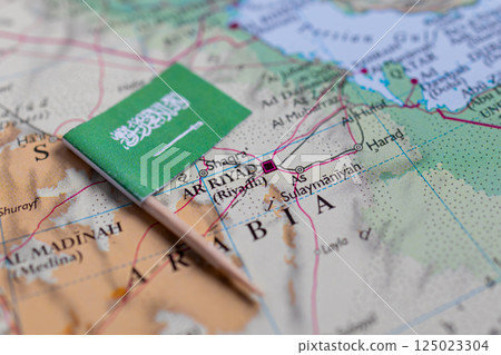 Flag of Saudi Arabia close-up on the map. Capital Riyadh. Close-up of the world map. Saudi Arabia Flag of Saudi Arabia close-up on the map. Capital Riyadh. Close-up of the world map. Saudi Arabia 125023304