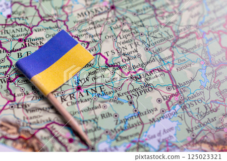 Flag of Ukraine close-up on the map. The capital Kiev. A close-up of the world map. Ukraine Flag of Ukraine close-up on the map. The capital Kiev. A close-up of the world map. Ukraine 125023321