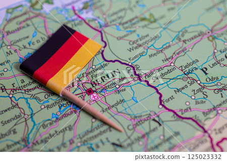 A close-up of the flag of Germany on the map. Capital Berlin. Close-up of the world map. Germany A close-up of the flag of Germany on the map. Capital Berlin. Close-up of the world map. Germany 125023332