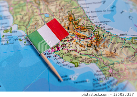 Flag of Italy close-up on the map. The capital Rome. Close-up of the world map. Italy 125023337