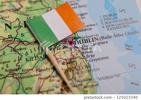 The flag of Ireland close-up on the map near the capital Dublin. Close-up map of the world. Ireland 125023340