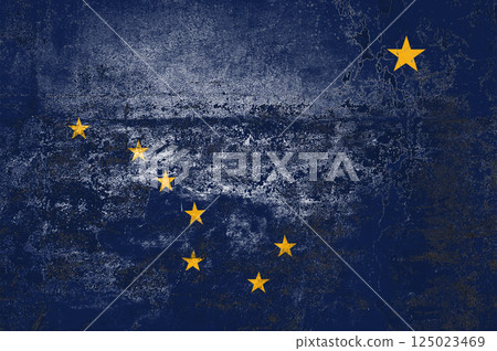 Alaska State Flag. Dirty Alaska state flag on the wall. 125023469