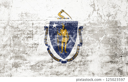 Massachusetts State Flag. Dirty Massachusetts state flag on the wall. 125023597