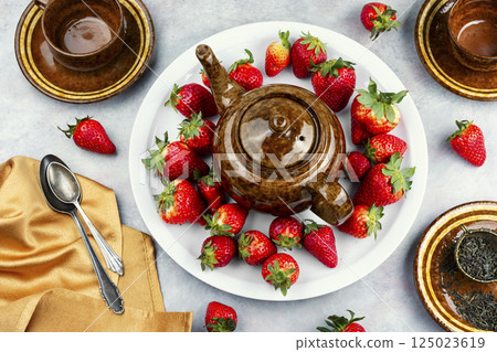 Strawberry tea with fresh strawberries. Strawberry tea with fresh strawberries. 125023619