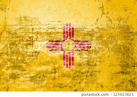 New Mexico State Flag. Dirty New Mexico state flag on the wall. New Mexico State Flag. Dirty New Mexico state flag on the wall. 125023621