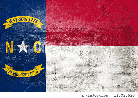 North Carolina State Flag. Dirty North Carolina state flag on the wall. 125023626