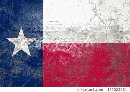 Texas State Flag. Dirty Texas state flag on the wall. Texas State Flag. Dirty Texas state flag on the wall. 125023681
