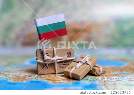 Flag of Bulgaria near the parcels on the world map. World trade. Exports and imports of goods. Economy of the country Flag of Bulgaria near the parcels on the world map. World trade. Exports and imports of goods. Economy of the country 125023735