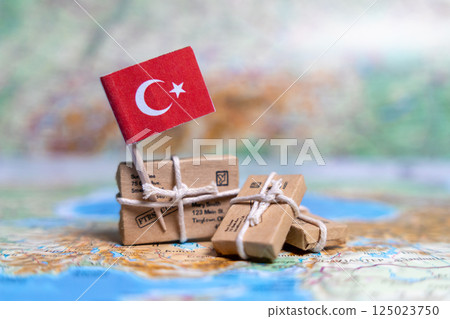 Flag of Turkey near the parcels on the world map. World trade. Exports and imports of goods. Economy of the country. Flag of Turkey near the parcels on the world map. World trade. Exports and imports of goods. Economy of the country. 125023750