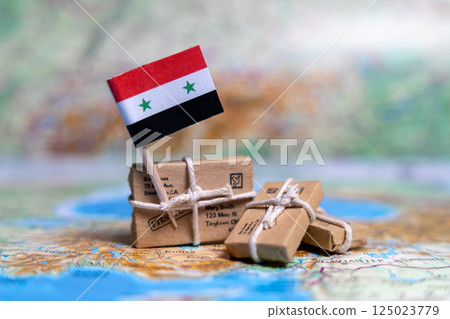 Flag of Syria near the parcels on the world map. World trade. Exports and imports of goods. Economy of the country 125023779