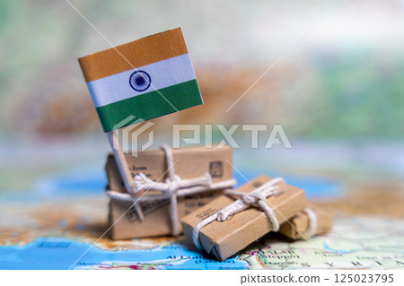 Flag of India near the parcels on the world map. World trade. Exports and imports of goods. Economy of the country 125023795