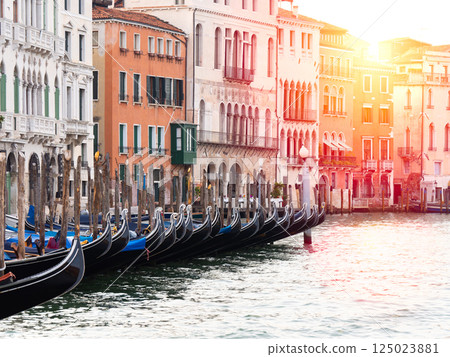 Row of Gondolas on Venice Grand Canal at Sunset 125023881