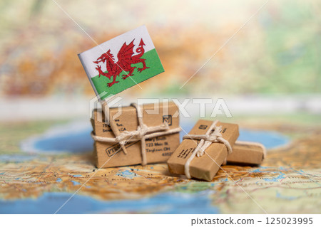 Global Shipping and Delivery Services to Wales: Small Business Parcels on Vintage Map with Welsh Dragon Flag Global Shipping and Delivery Services to Wales: Small Business Parcels on Vintage Map with Welsh Dragon Flag 125023995