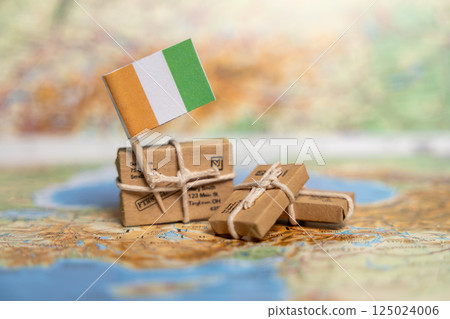 International Shipping to Ivory Coast: Exploring Package Delivery Services with National Flag and Parcels Displayed on Geographic Map 125024006