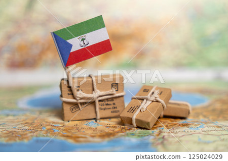 International Shipping to Equatorial Guinea: Small Parcels with Equatorial Guinean Flag on World Map, Global Postal Delivery Services Concept 125024029
