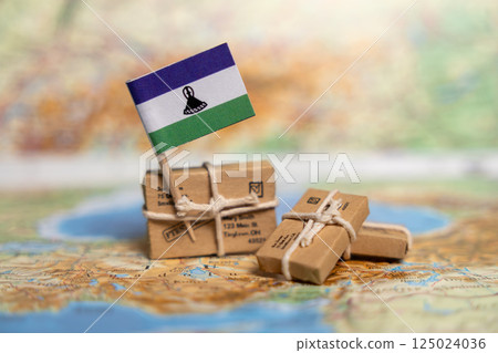Shipping and Export Services to Lesotho: International Trade, Logistics, and Package Delivery Solutions on World Map Background 125024036