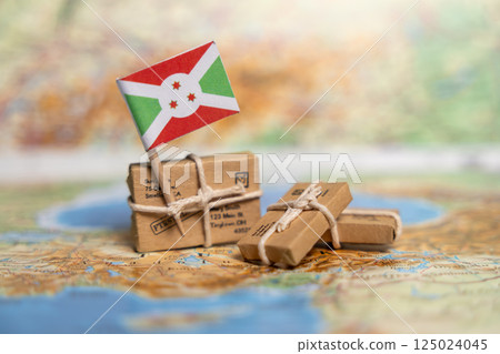 International Shipping and Delivery Services to Burundi: Small Packages with Flag on World Map Background, Export Logistics Concept 125024045