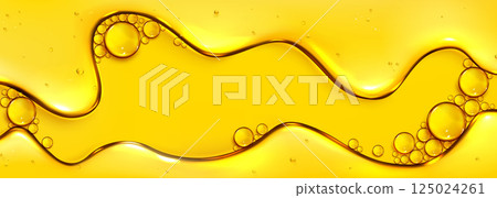 Flowing yellow oil liquid texture with bubbles 125024261