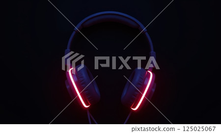 Wired over-ear headphones with red LED lighting on dark background. Futuristic music and gaming audio technology concept, copy space Wired over-ear headphones with red LED lighting on dark background. Futuristic music and gaming audio technology concept, copy space 125025067