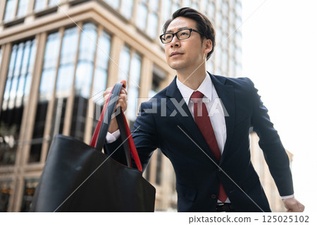 Running businessman Running businessman 125025102