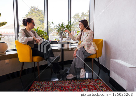 Business content development over coffee. Concept of team alignment and remote leadership. Wide shot 125025268