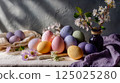Pastel Easter Eggs and Spring Flowers on Rustic Table 125025280