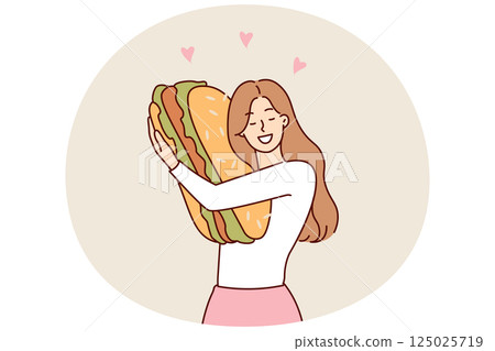 Happy woman hugging giant hamburger missing fast food after long diet to maintain slim figure 125025719